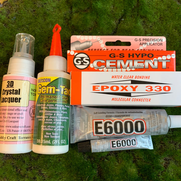 3d crystal lacquer glue, gem-tak glue, g-s hypo cement, epoxy 330, e6000 glue on green background