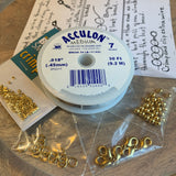 basic beading tool kit full of jewelry making supplies including chain nose pliers, soft wire cutters, beading wire, crimp beads, soldered rings, lobster claw clasps and 4mm round beads