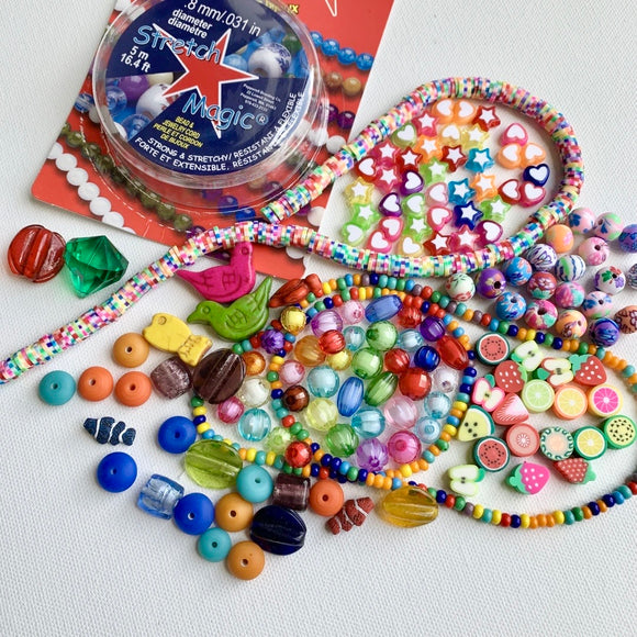 Bead kit full of jewelry making supplies perfect to make beaded bracelets. Kit includes glass beads, seed beads, heishi beads and charms