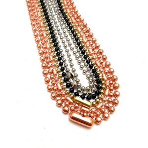 stainless steel, black, brass, and copper ball chain on a white background