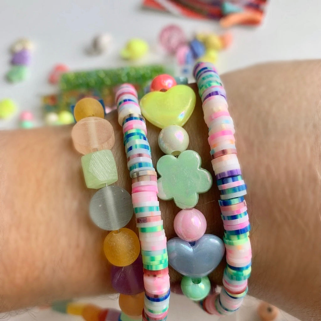 Bead kit full of jewelry making supplies perfect to make beaded bracelets. Kit includes glass beads, seed beads, heishi beads and charms