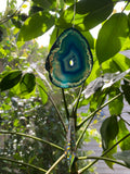 dyed agate slice with prism sun catcher with leafy background